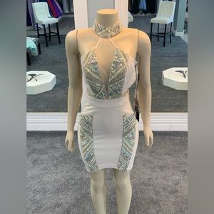 Size 4. cutout. bodycon. sheer. jeweled neckline. back cutout